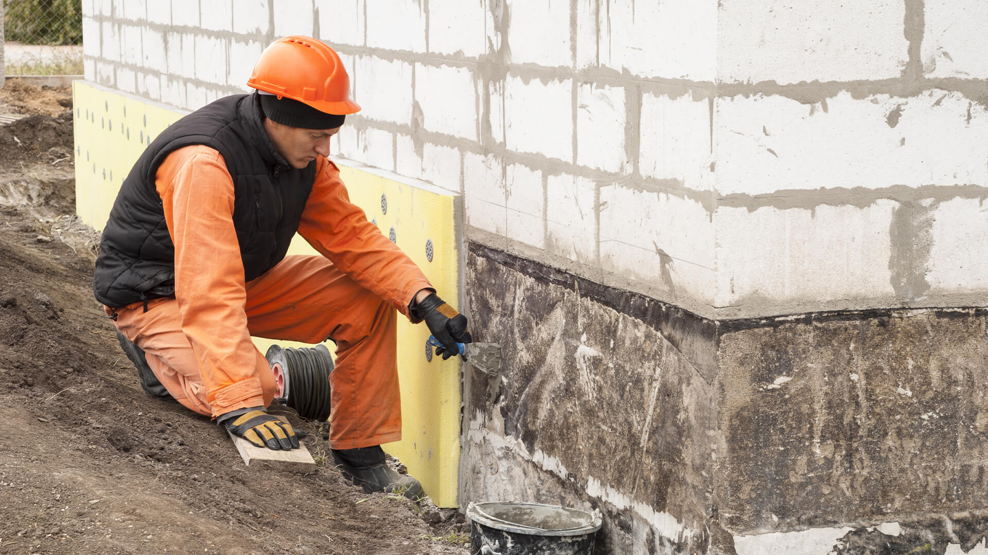 Foundation repair technician working on a home in Austin, Texas